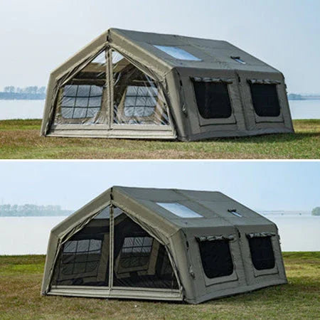 Spacious outdoor camping tent with multiple windows set up on grass by a lakeside.
