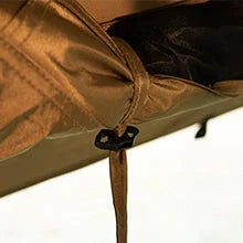Close-up of brown outdoor tent fabric with secure tie and clip details